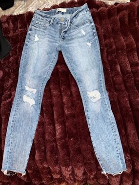 Buckle Light Blue Distressed Skinny Jeans